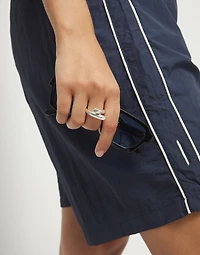 Ring with two intertwined organic forms