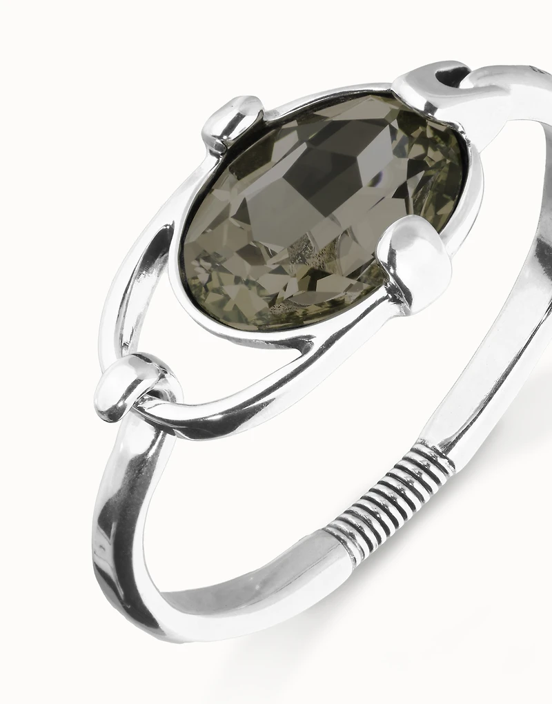 Bangle bracelet with oval faceted gray crystal