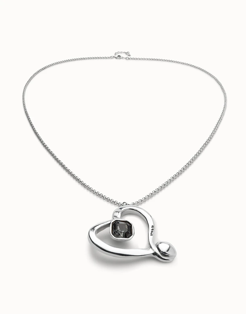 Long chain pendant necklace with a large heart