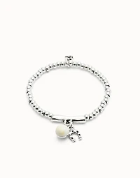 Beaded stretch bracelet with a murano glass and a horseshoe charm