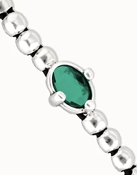 Beaded bracelet with oval faceted green crystal