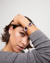 Bangle bracelet with two pink crystals