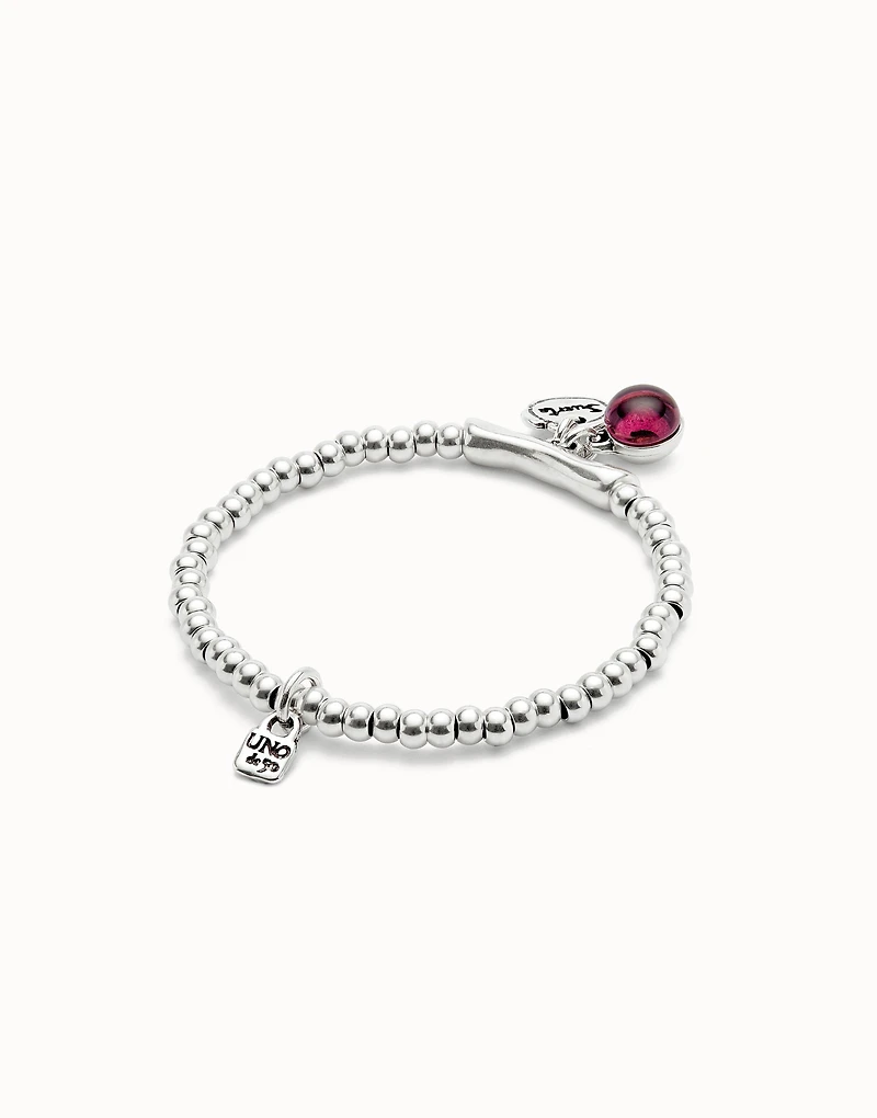 Beaded stretch bracelet with a murano glass and the word lucky