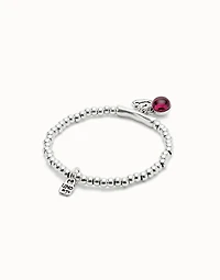 Beaded stretch bracelet with a murano glass and the word lucky