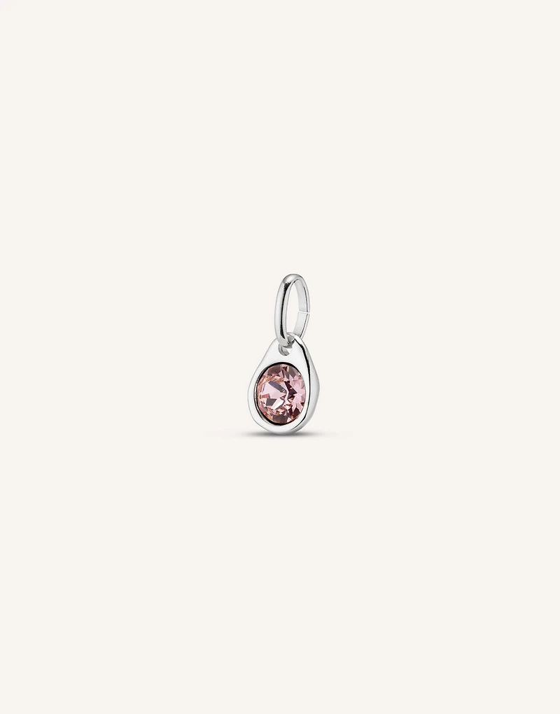 Charm with a pink crystal