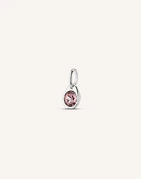 Charm with a pink crystal