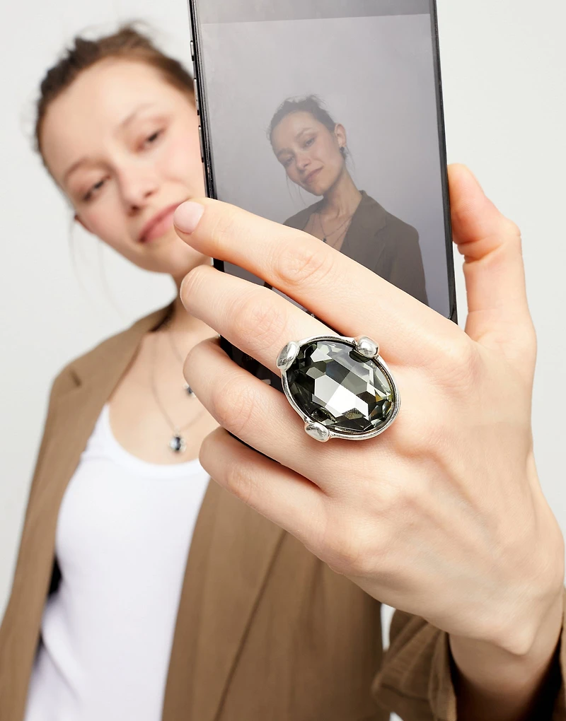 Large ring with grey oval faceted crystal
