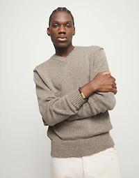 Brown braided leather bracelet with a metal detail