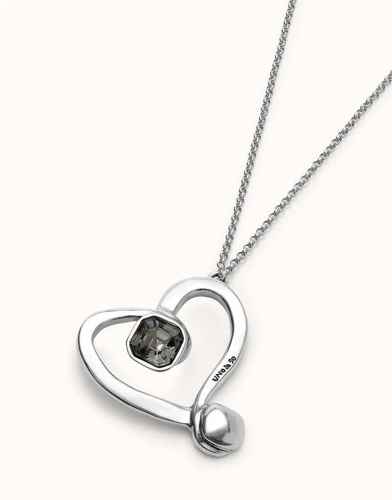 Long chain pendant necklace with a large heart