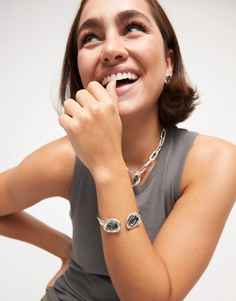 Bangle bracelet with two grey crystals
