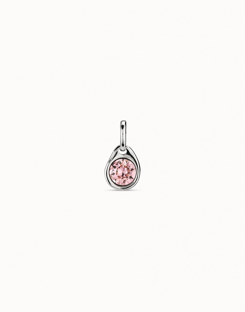 Charm with a pink crystal