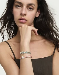 Orange silk thread and metal bracelet with starfish