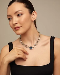 Short link chain necklace with large blue crystal