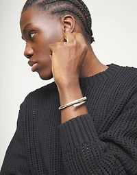 Bangle bracelet with intertwined organic shapes