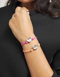 Pink elastic thread bracelet with heart charm