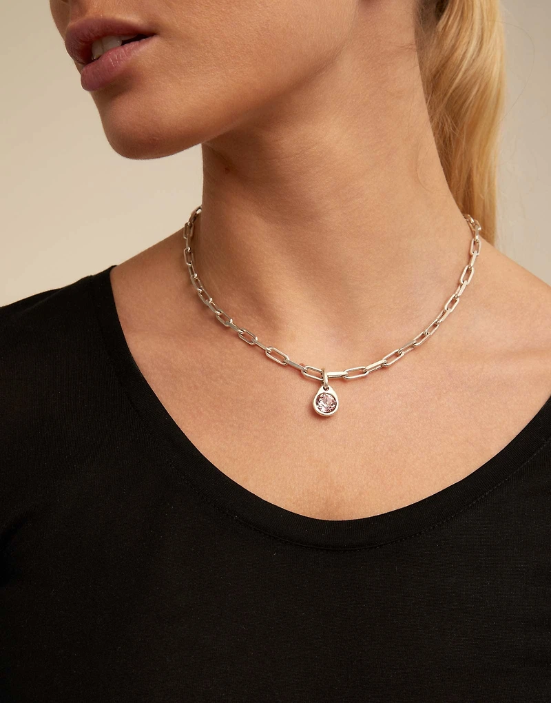 Charm with a pink crystal