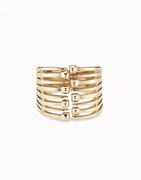 Bangle bracelet with multiple nail heads