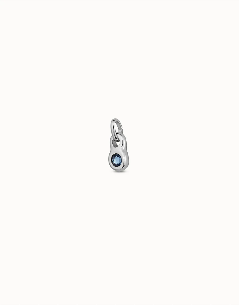 Round shaped Charm with a blue crystal
