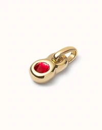 Charm with red crystal