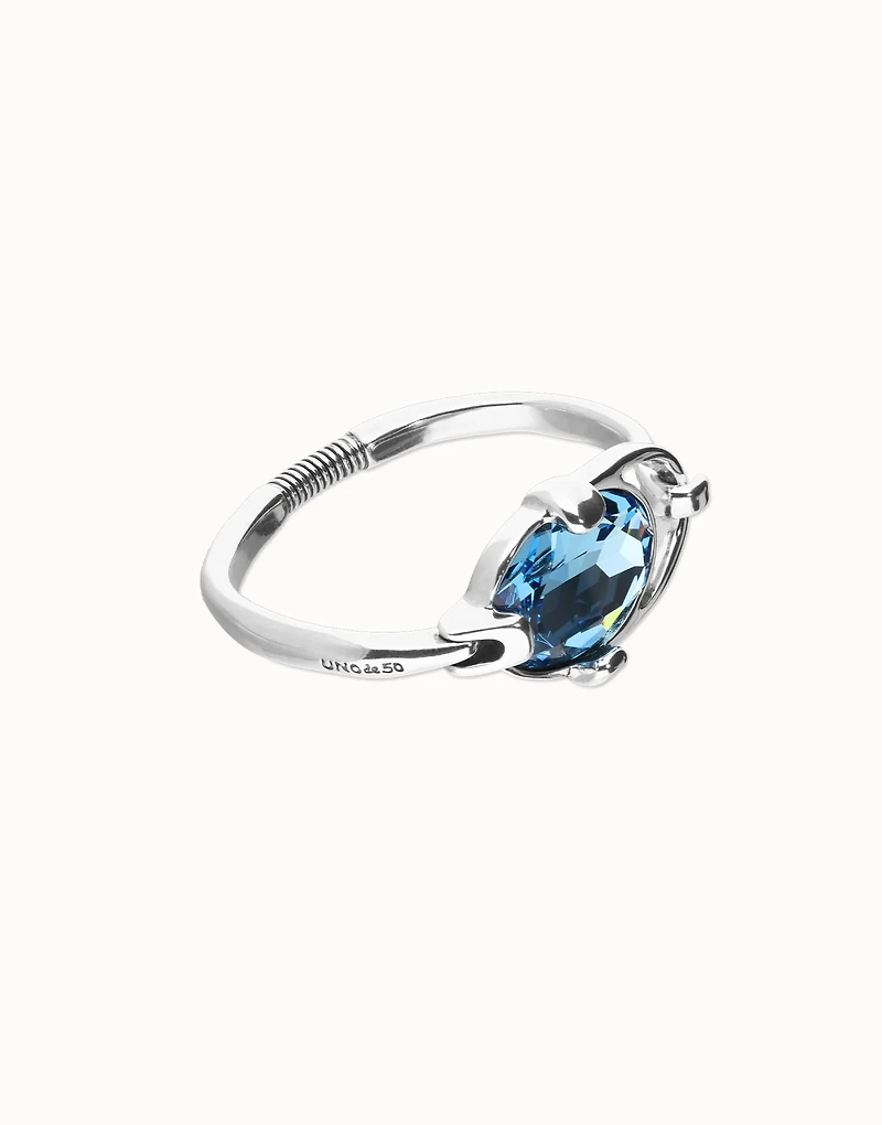 Bangle bracelet with faceted blue crystal