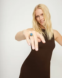 Rectangular ring with blue faceted crystal