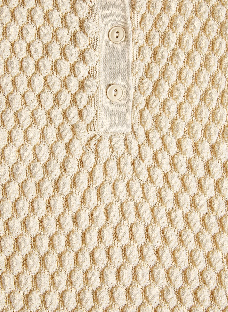 Polo sans manches en tricot texturé