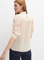 Blouse à manches bouffantes drapées