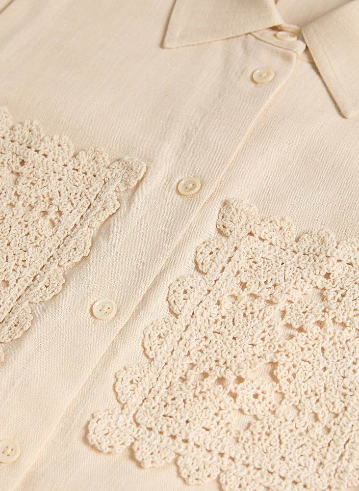 Blouse sans manches à poches en crochet
