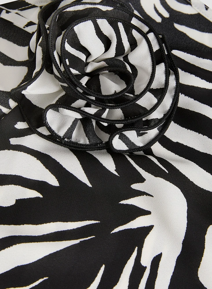 Blouse à rosette abstraite et col licou