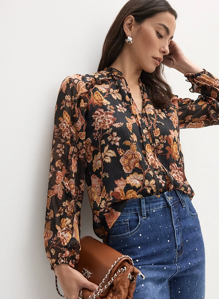 Blouse florale à encolure volantée