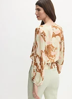 Blouse florale à manches plissées