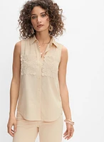 Blouse sans manches à poches en crochet