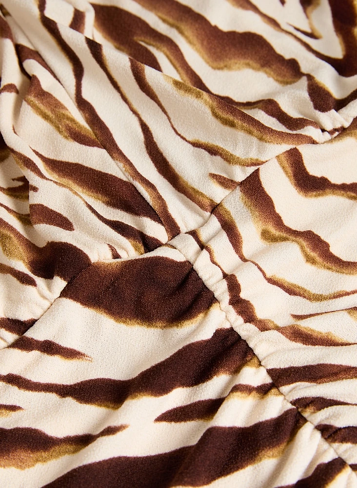 Haut à motif zèbre et manches dolman