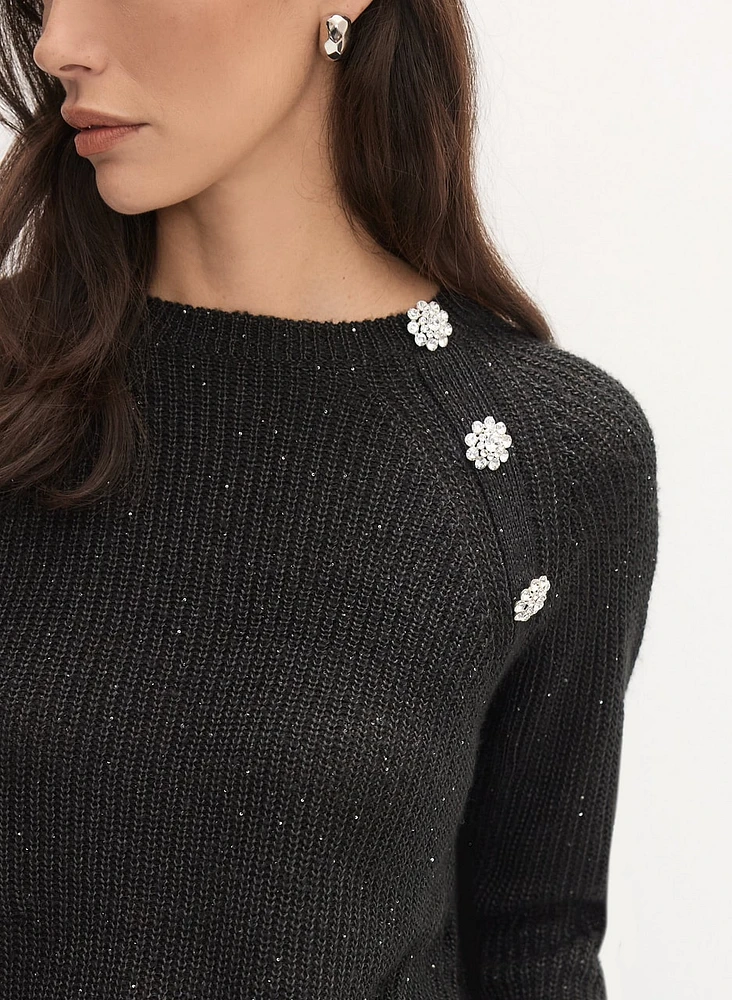 Pull asymétrique à boutons fantaisie