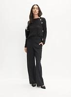 Pull asymétrique à boutons fantaisie