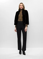 Manteau en fourrure végane et haut smocké