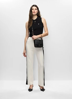 Pull sans manches et pantalon à bandes