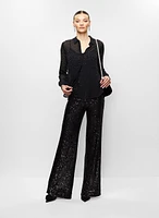 Chemisier à clous et pantalon à sequins