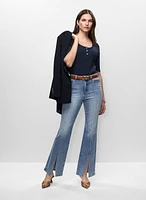 Veste mi-longue et jean à fente et surpiqûres