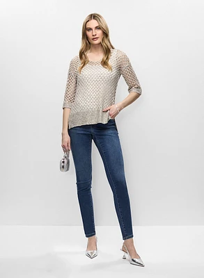 Pull en maille ouverte et jean étroit