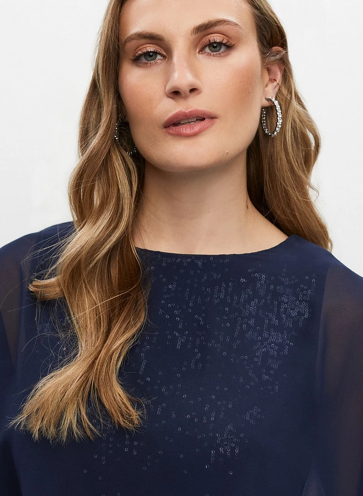 Robe fourreau pailletée à drapé cape