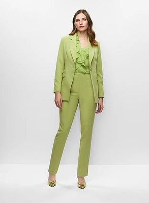 Veste mi-longue et chemisier à volants