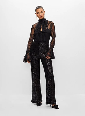Haut en dentelle et pantalon à sequins