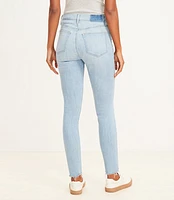 Petite Destructed Button Front High Rise Skinny Jeans Light Wash