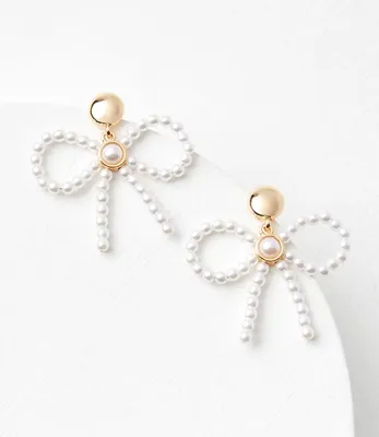 Pearlized Bow Statement Earrings