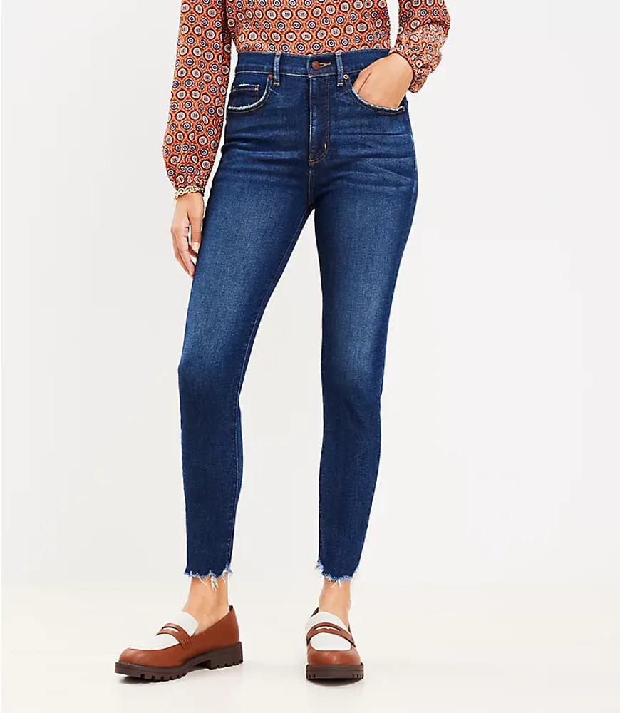 Mid Rise Light Wash Ripped Raw Hem Skinny Jeans