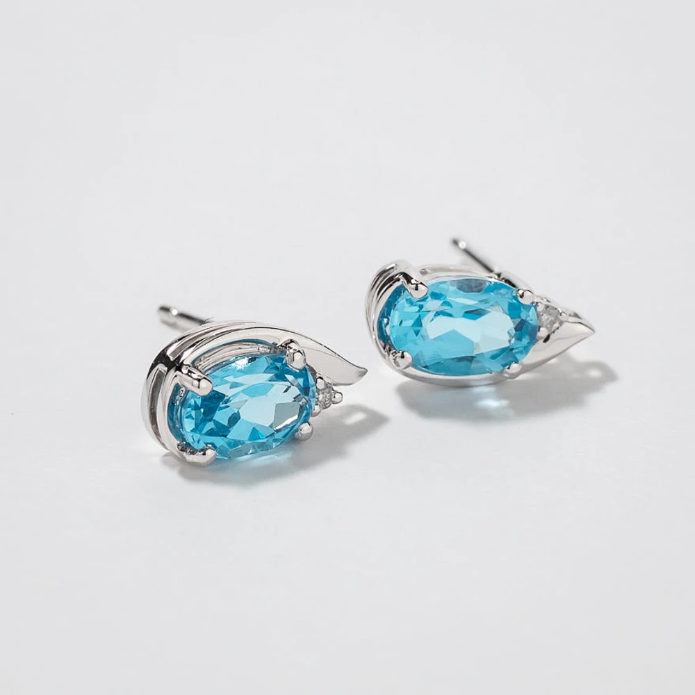 Oval Blue Topaz Earrings in 10K White Gold