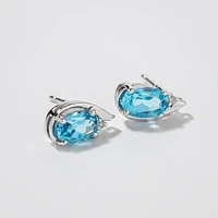Oval Blue Topaz Earrings in 10K White Gold