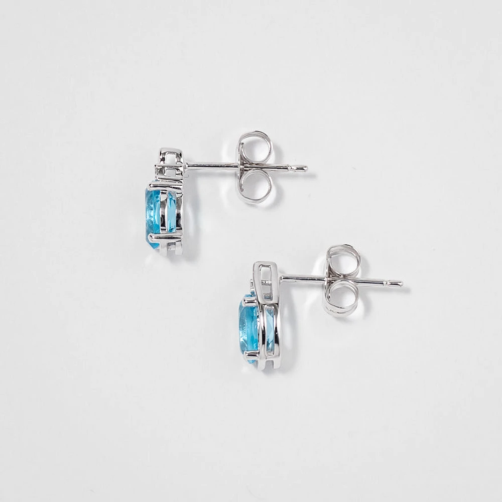 Oval Blue Topaz Earrings in 10K White Gold