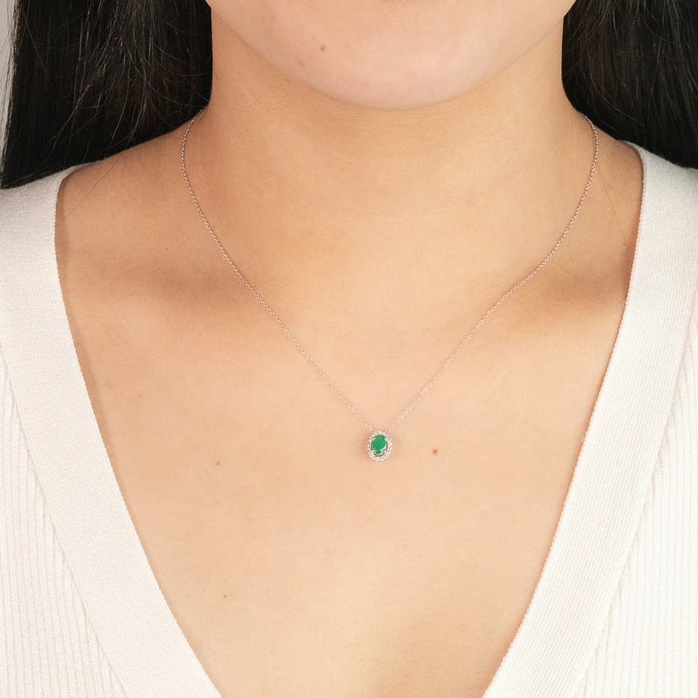 Oval Emerald and Diamond Halo Necklace in 10K White Gold (0.12ct tw)